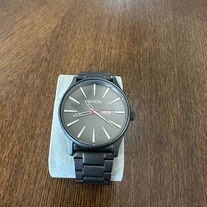 Nixon Black and Gray Watch with Day-Date Feature